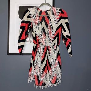Peachy Red, Off White, and Black Romper with White Lace Detail in a Size Medium